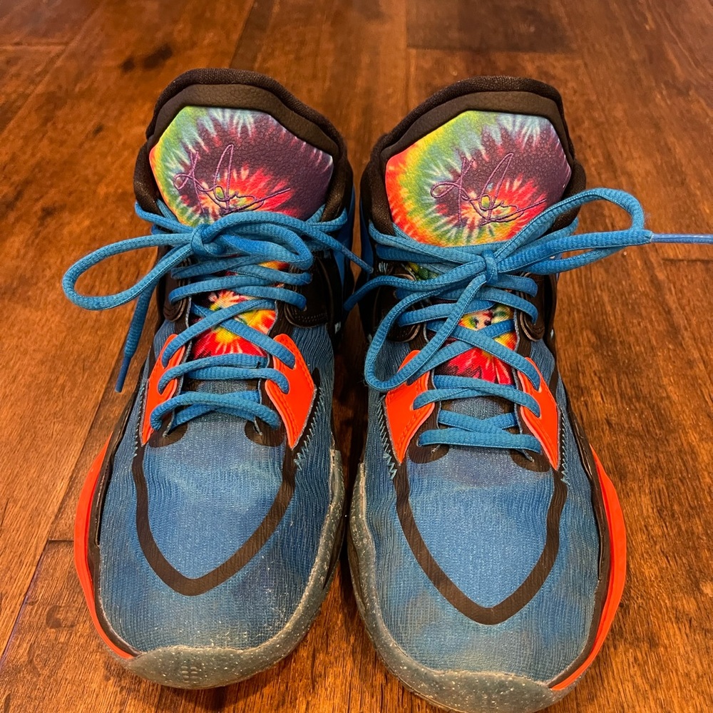 Nike Kyrie sneakers on blue tie dye